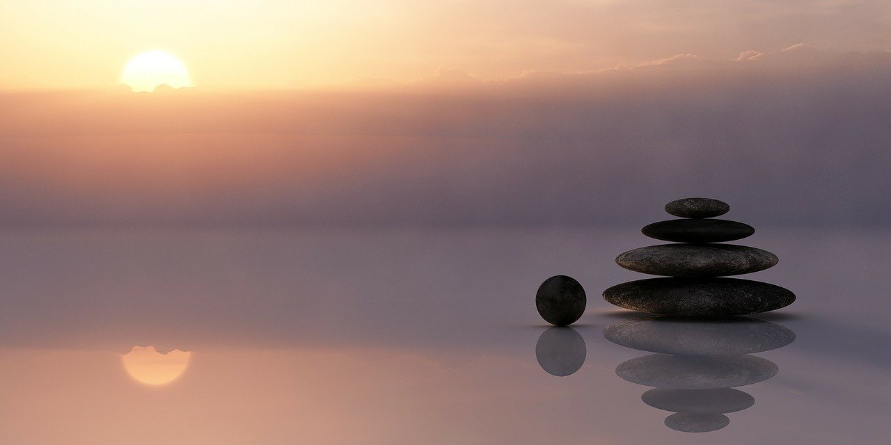 sunset balance pebbles